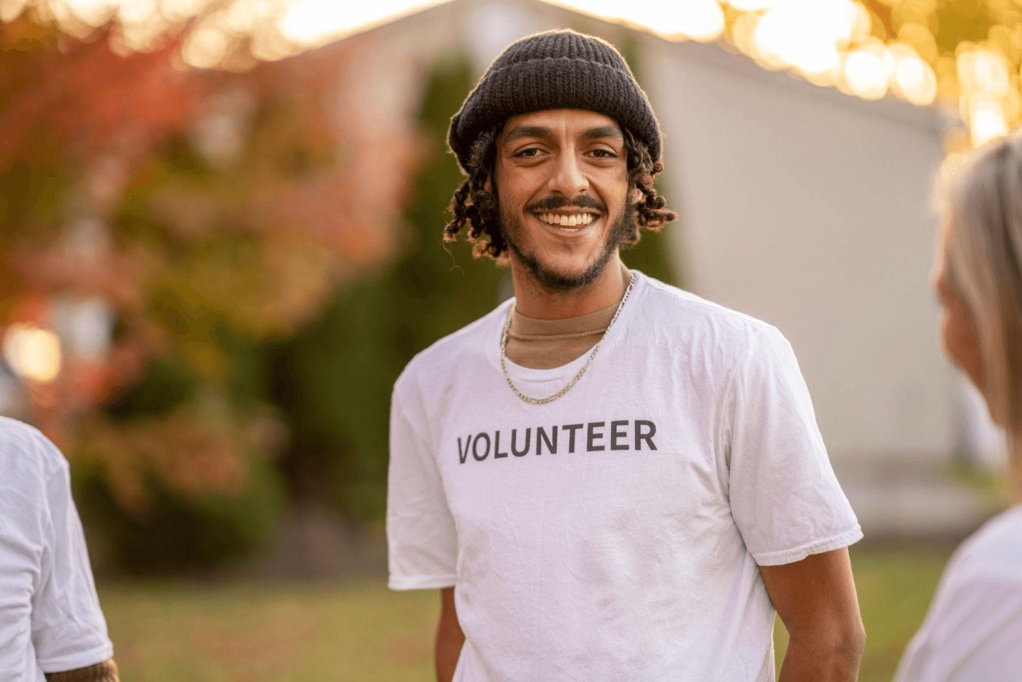 Aaron Schmidt smiling and engaging as a volunteer and education coordinator in a community setting