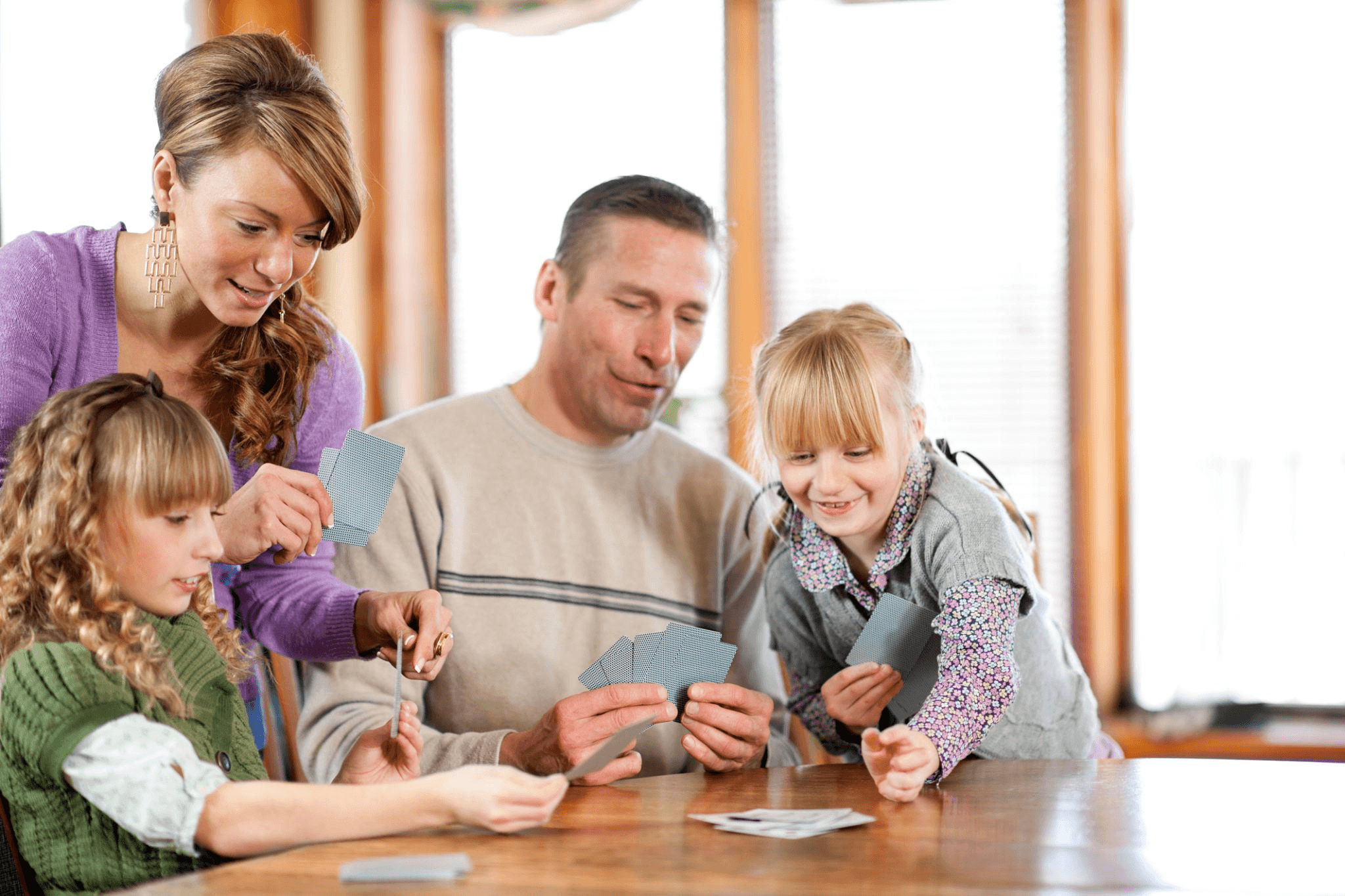 Family playing a card game together