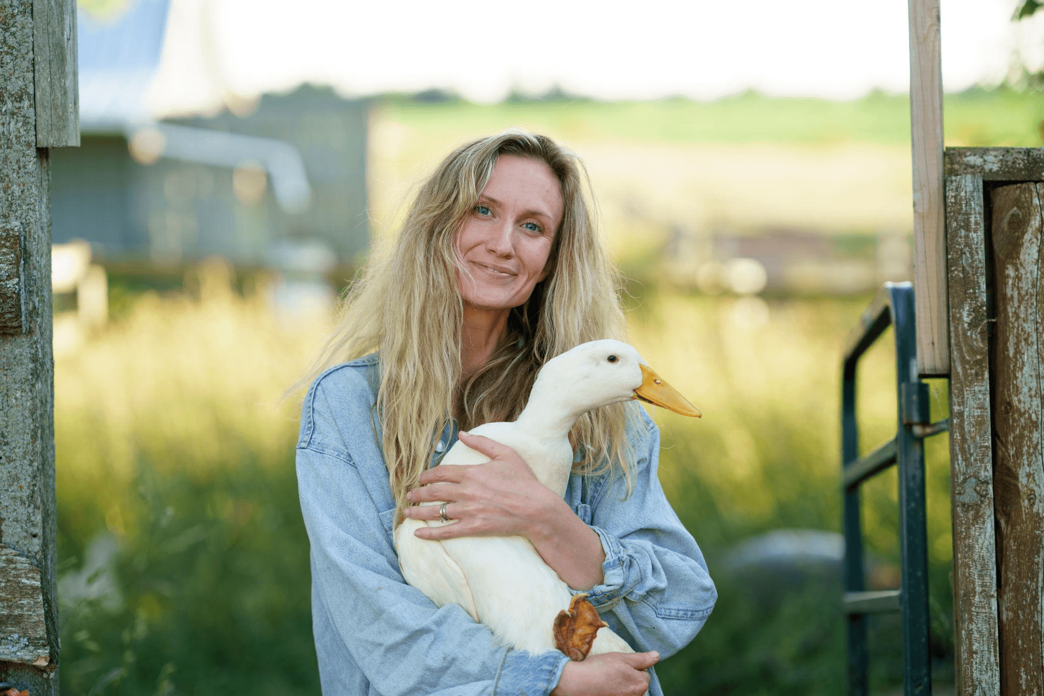 Darlene Banerd holding a duck outdoors