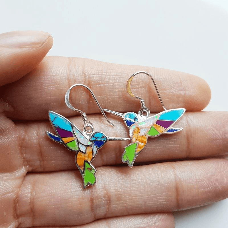 Colorful bird-shaped glass earrings inspired by wildlife