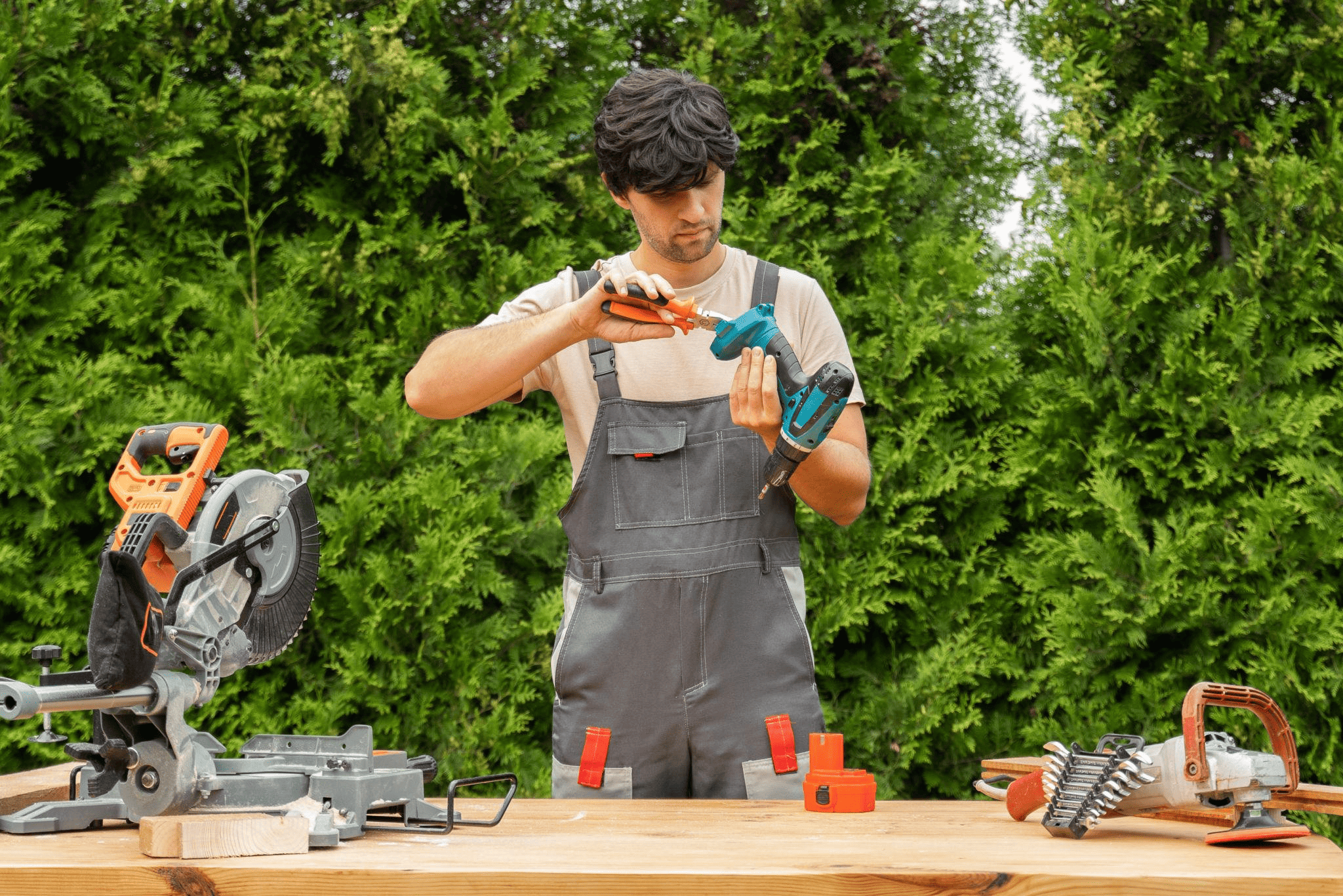 John Turner performing maintenance work using tools