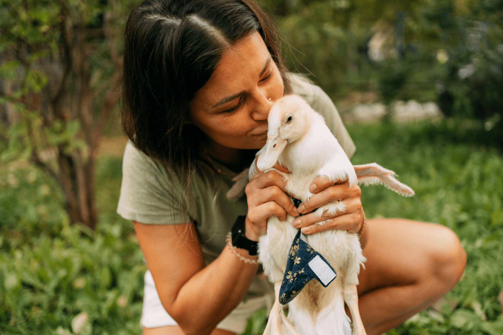 Therisa Lowe caring for a duck outdoors